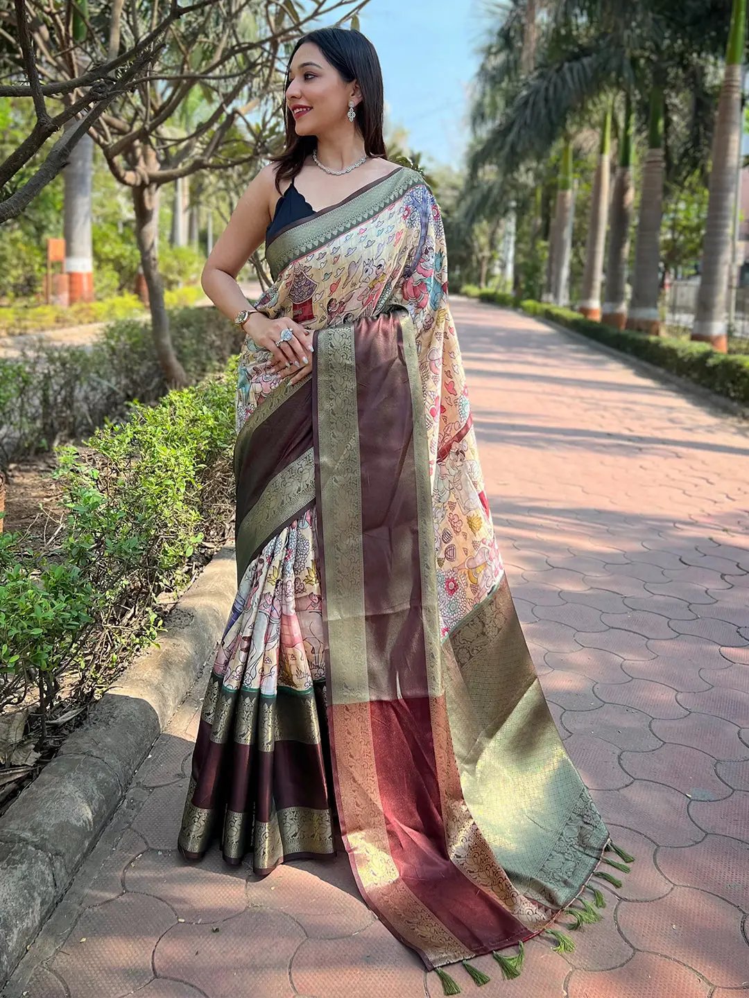 Woman wearing light green Banarasi silk saree with double border