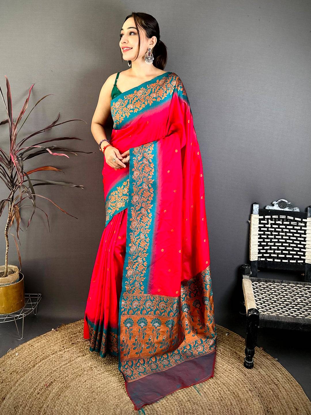 Pink Silk Saree with Gold Floral Border on Gray Background