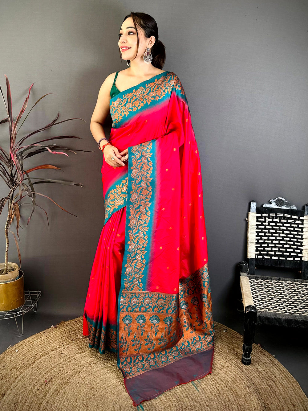 Pink Silk Saree with Gold Floral Border on Gray Background