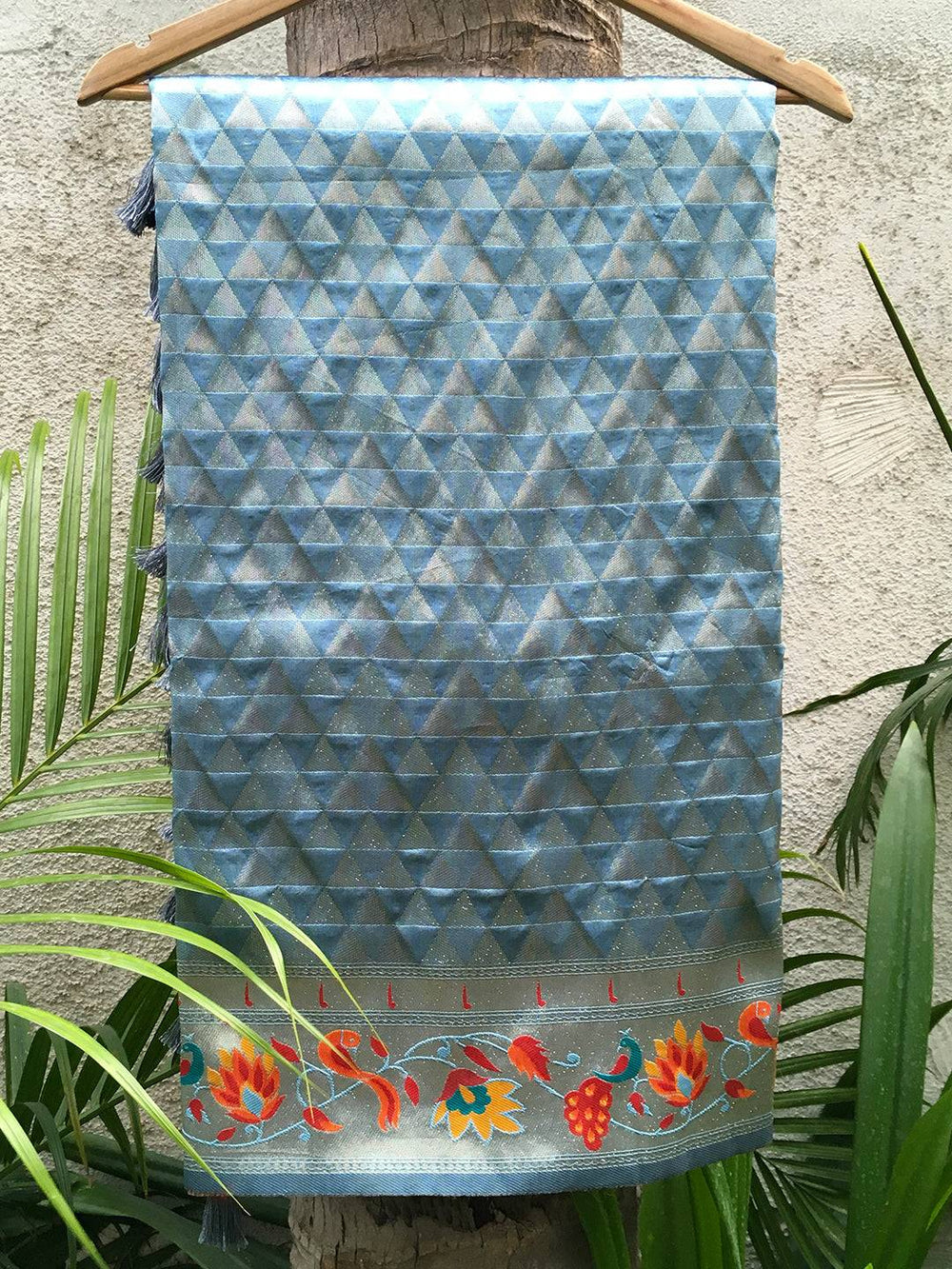 Light blue silk Paithani saree with geometric and floral zari.
