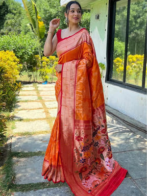 Orange Paithani silk saree with intricate Pichwai design