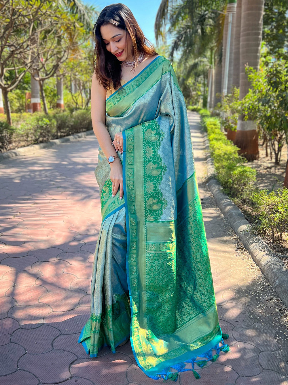 Elegant green Kanjivaram silk saree with intricate patterns