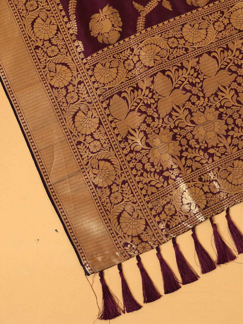 Close-up of wine silk blend dupatta with resham tassels