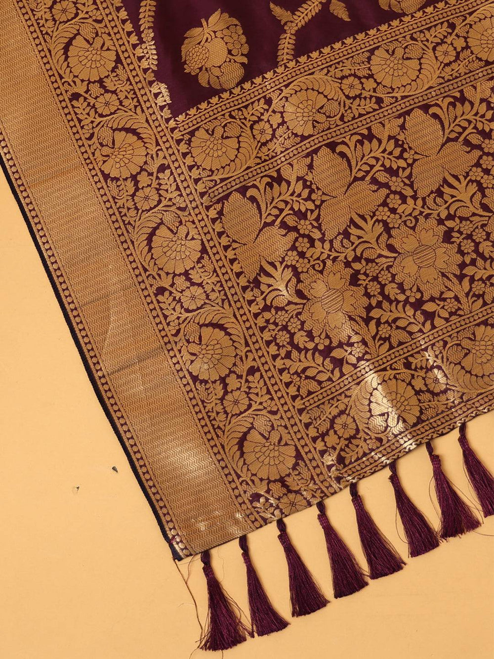 Close-up of wine silk blend dupatta with resham tassels