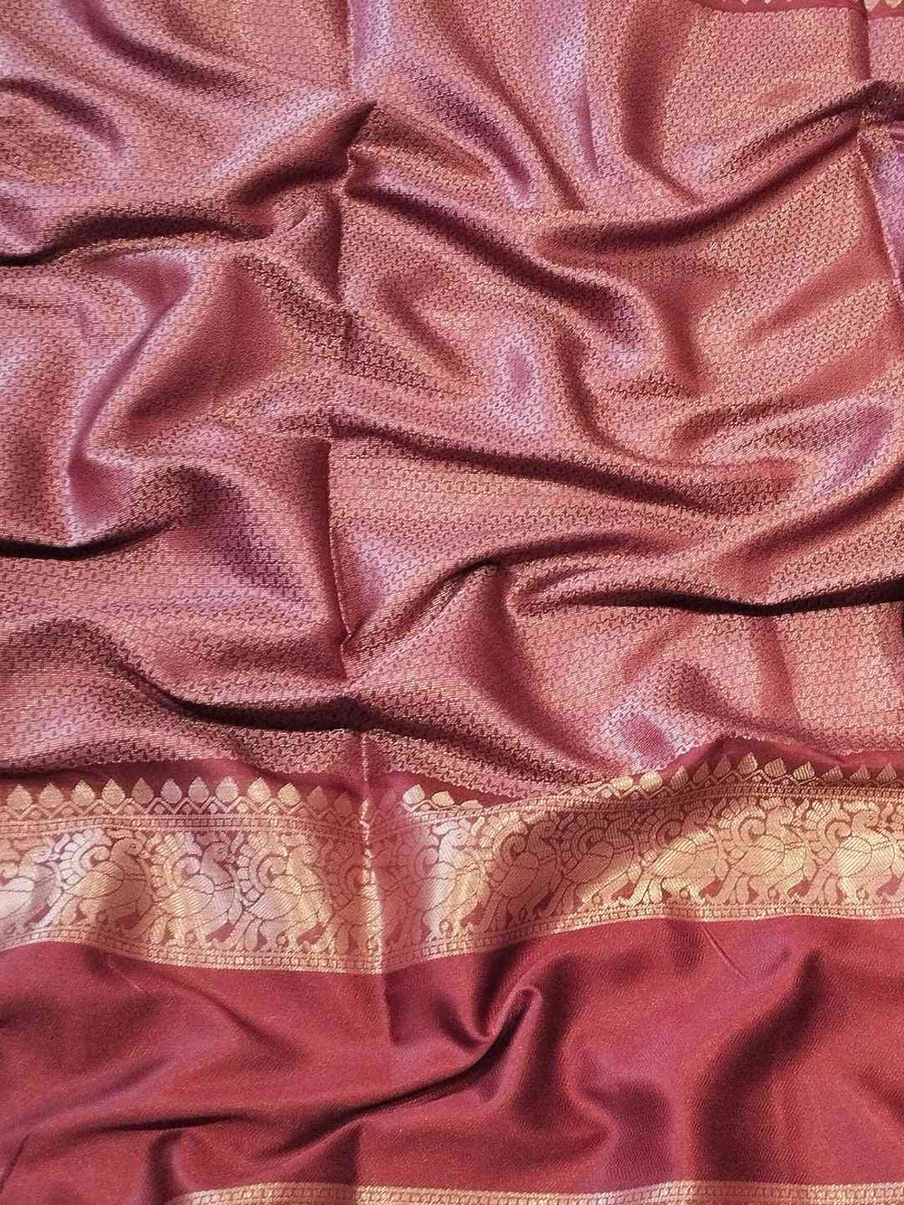 Detailed view of Banarasi silk saree fabric and border