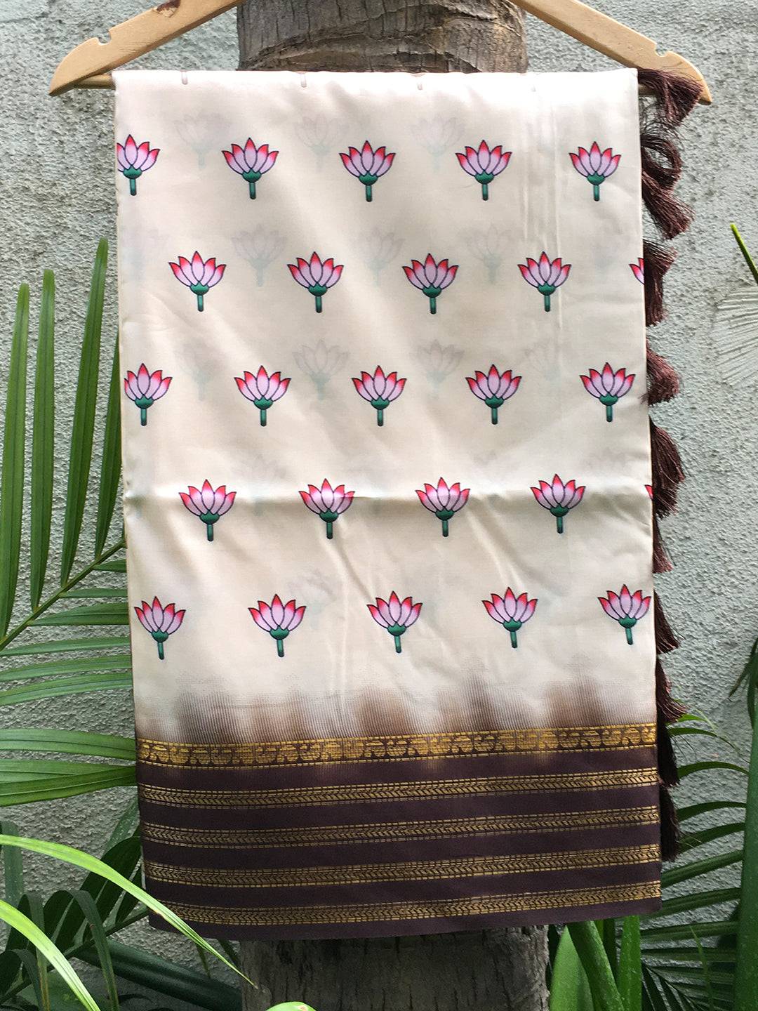 Cream 2 Ton Lotus Print Silk Saree hanging display