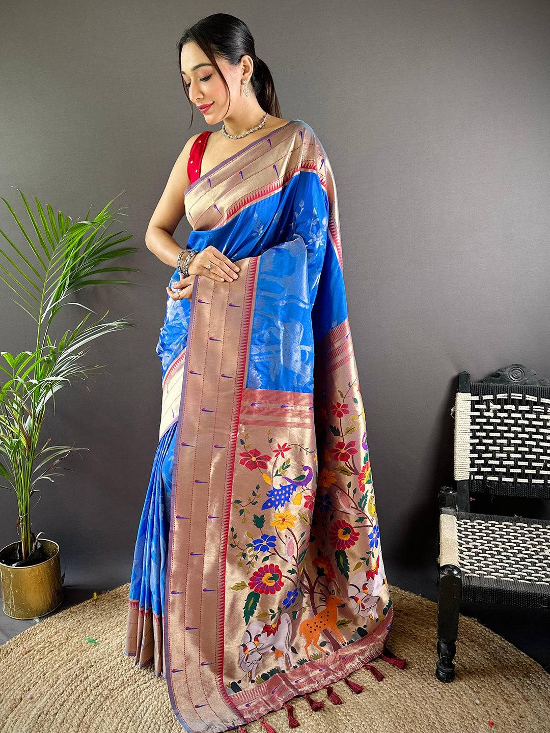 Model showcasing Royal Blue Paithani Silk Saree with intricate Pichwai patterns.