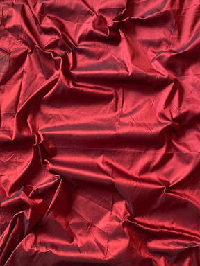 Red blouse piece fabric for teal Paithani saree.