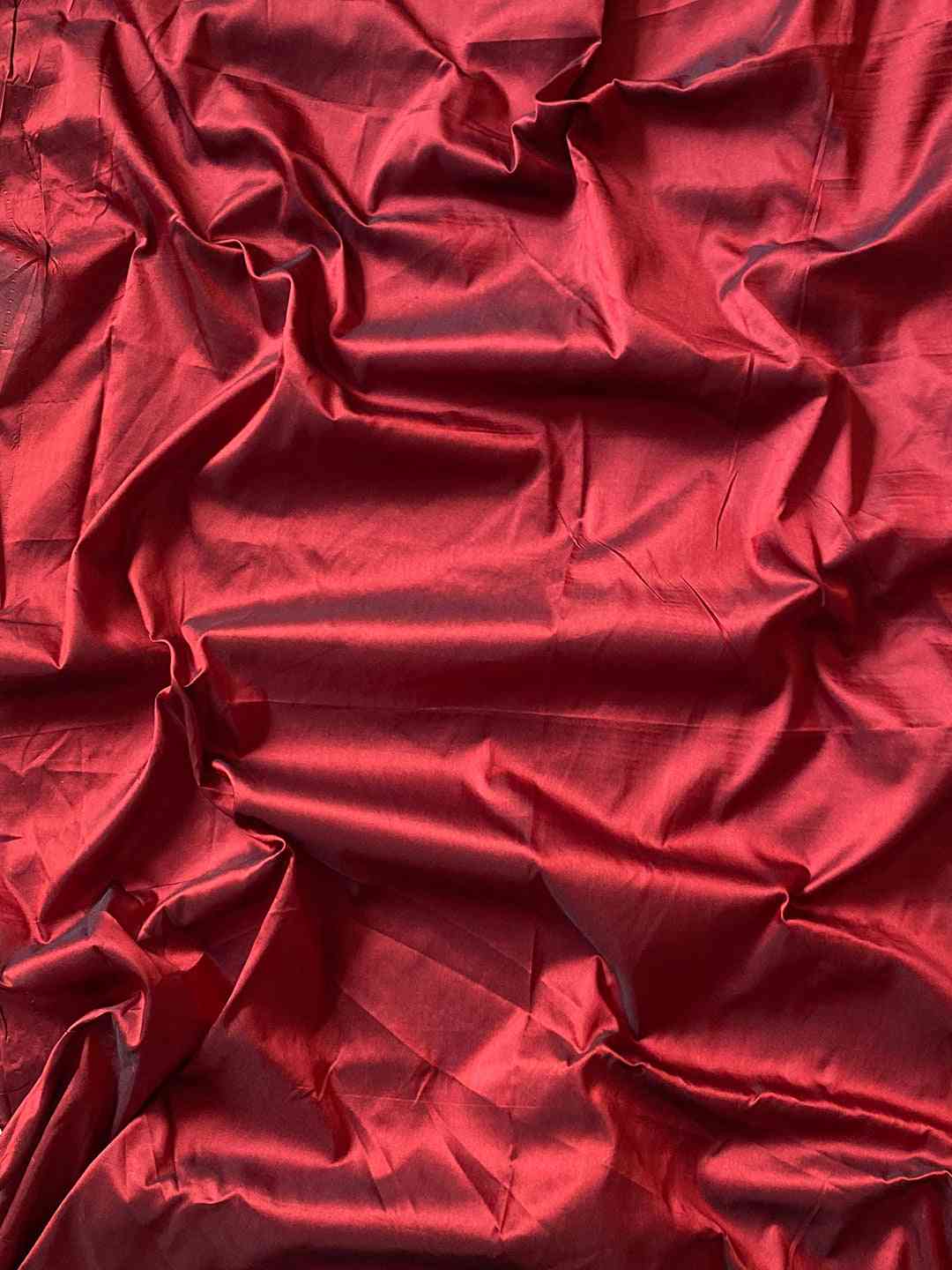 Red blouse piece fabric for teal Paithani saree.