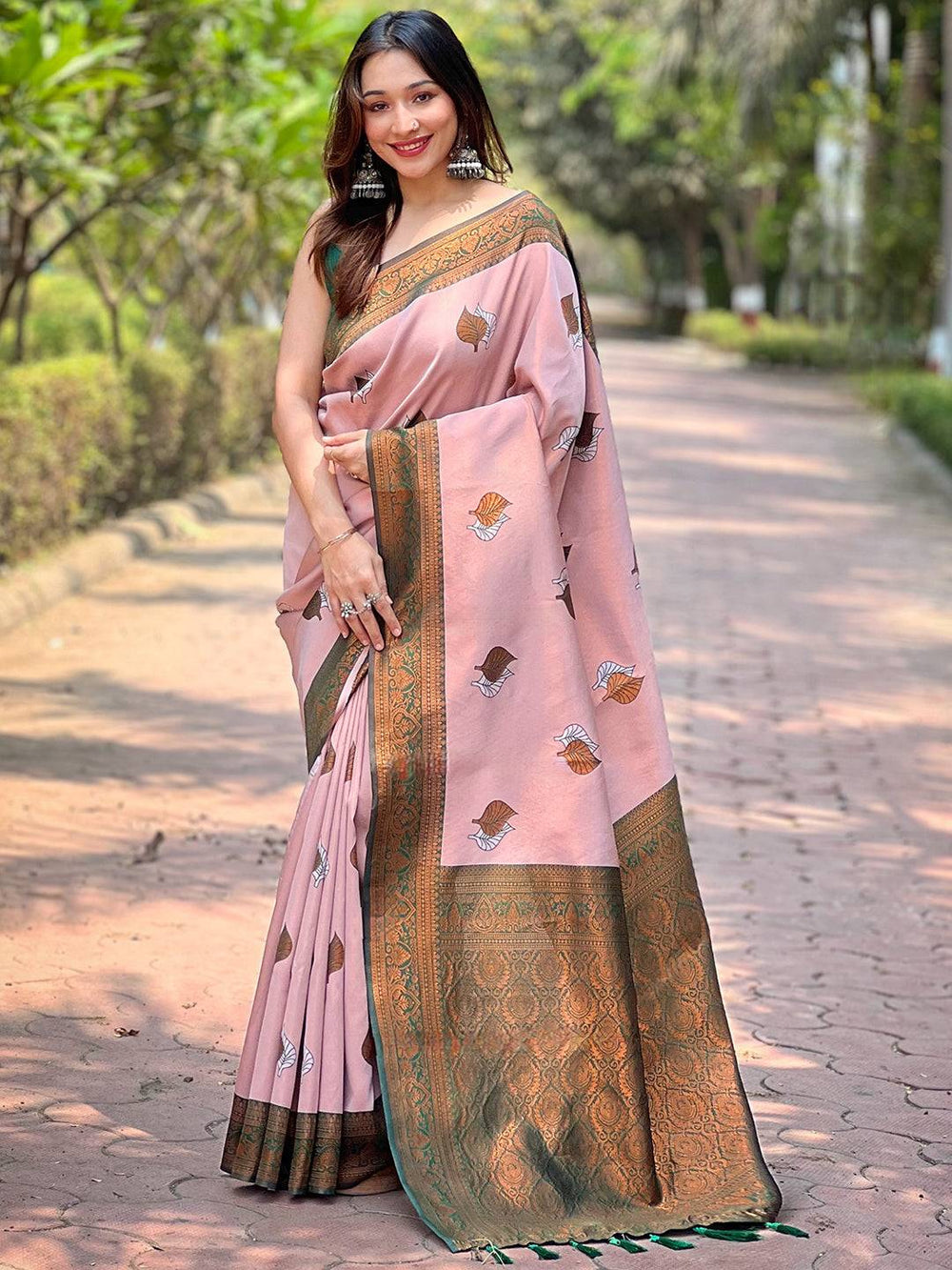 Light pink Kanjivaram saree with intricate gold border, full view