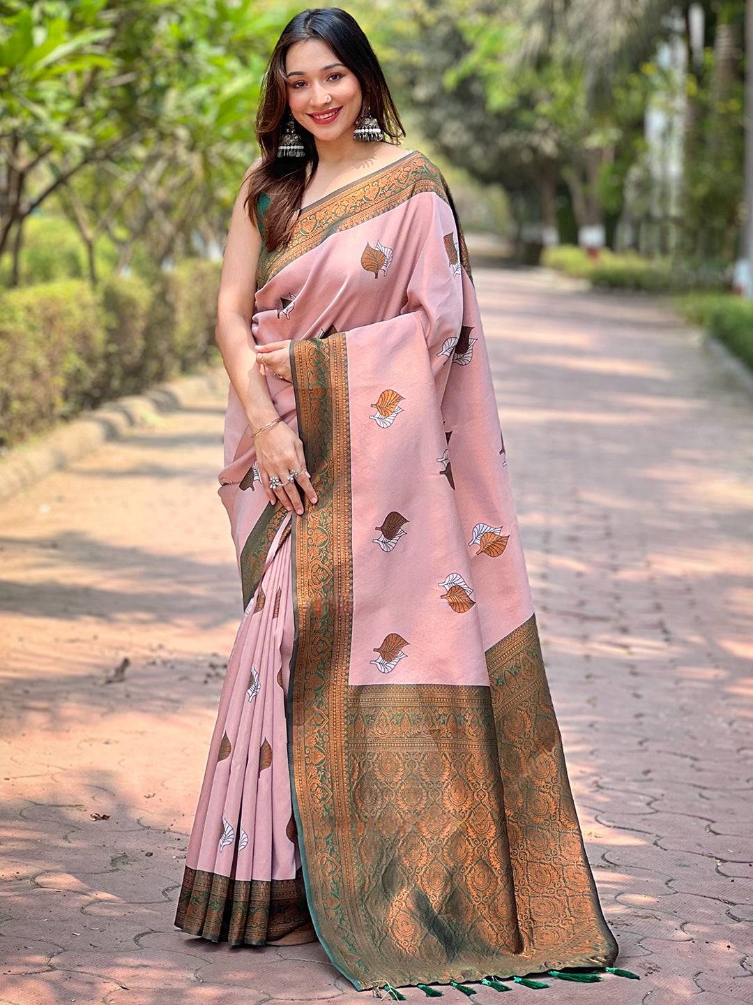 Light pink Kanjivaram saree with intricate gold border, full view