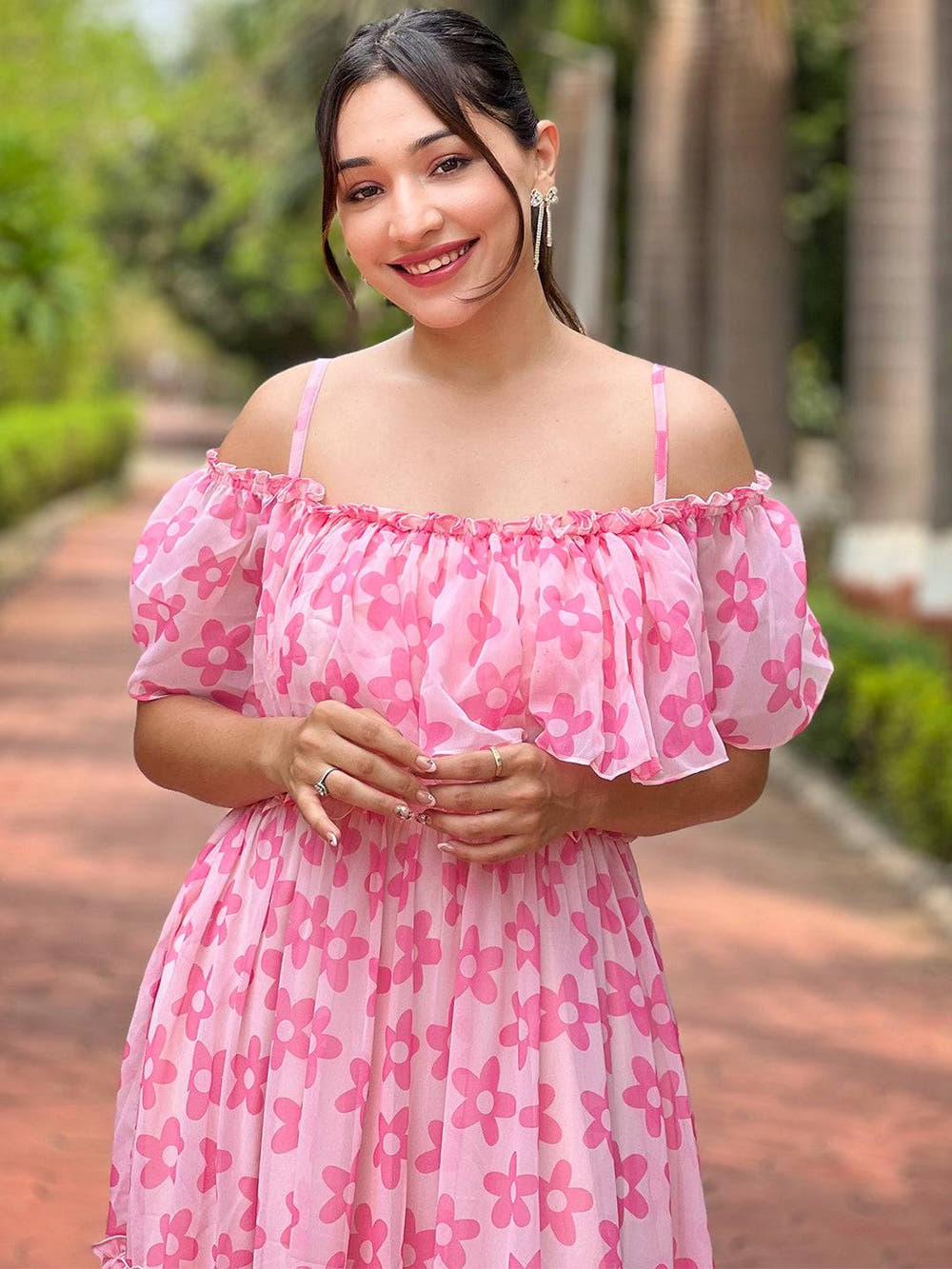 Model wearing pink flower dress with off-shoulder style