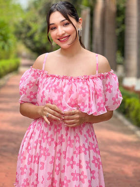 Model wearing pink flower dress with off-shoulder style