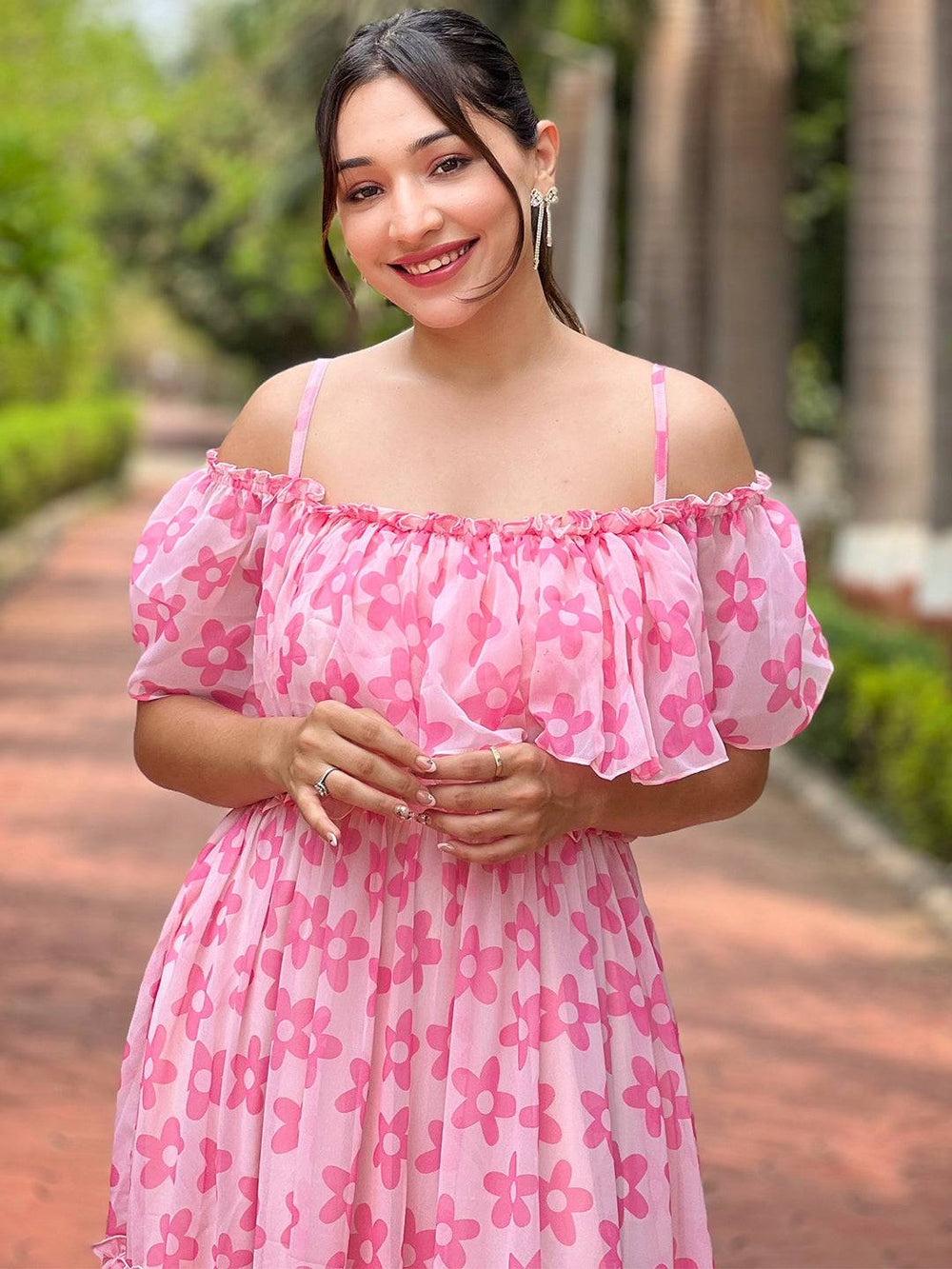 Model wearing pink flower dress with off-shoulder style