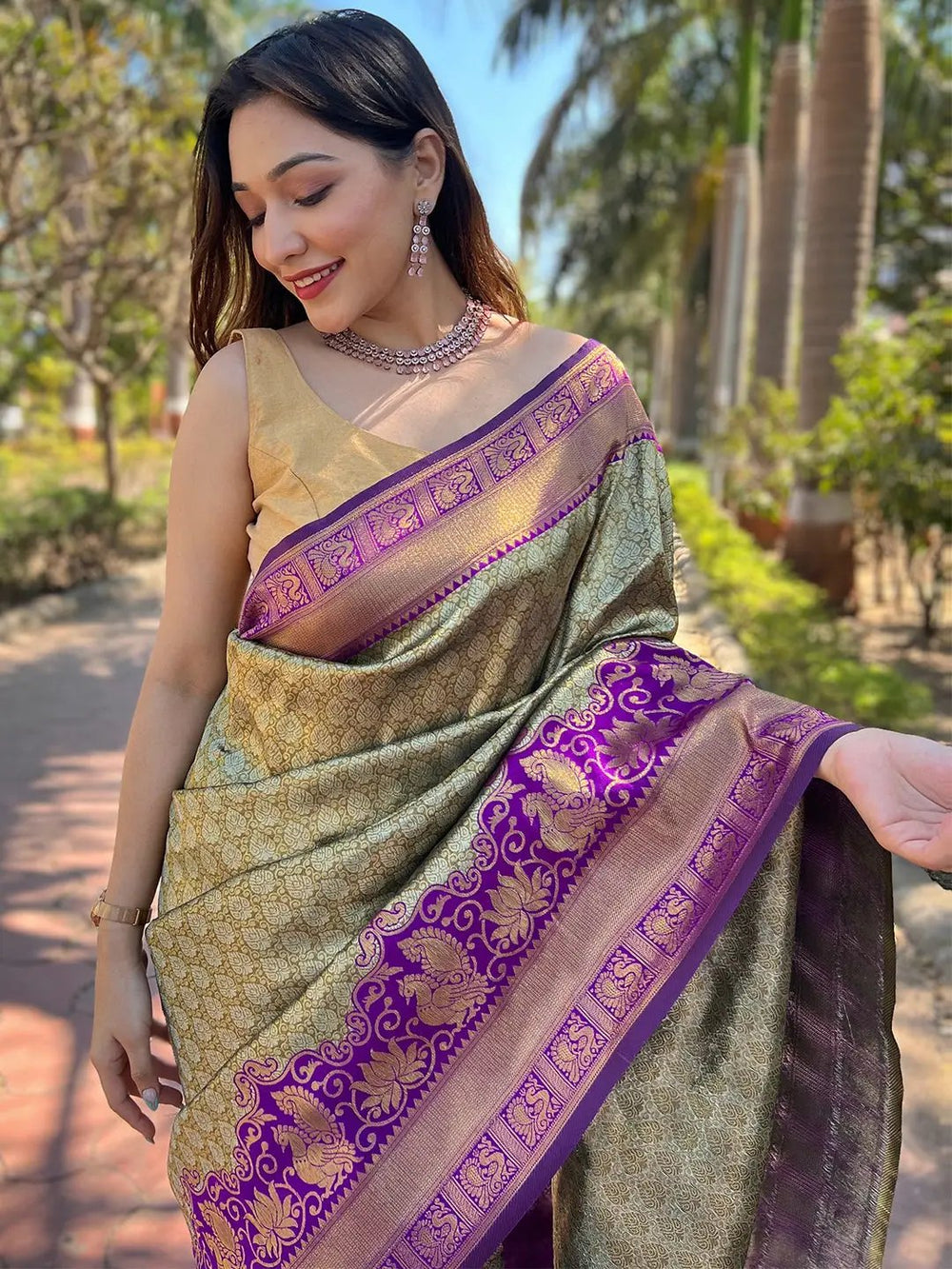 Close-up of gold tissue Kanjivaram saree with purple border