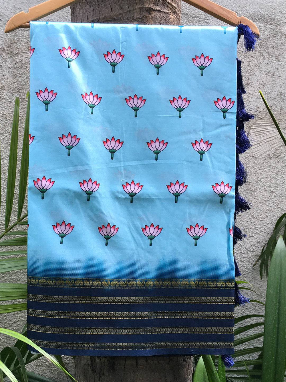 Dark blue silk saree with lotus print and intricate border