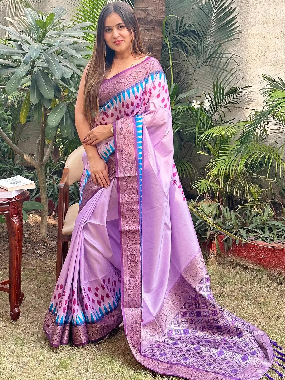 Elegant Banarasi soft silk saree with Patola pallu in garden setting
