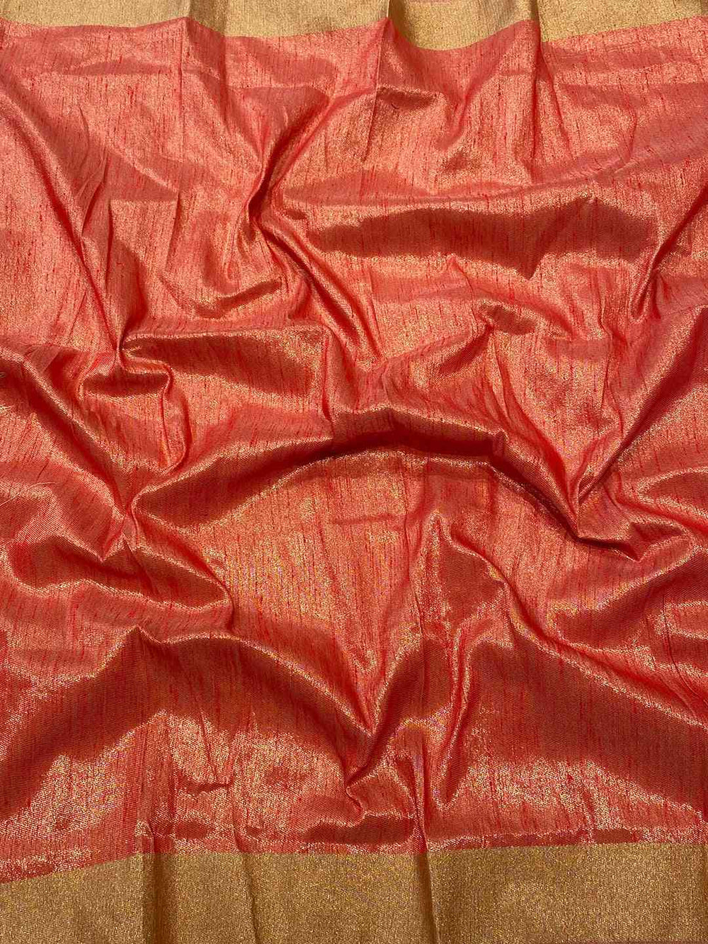 Detailed view of red and gold fabric of the Kalamkari Linen Saree.