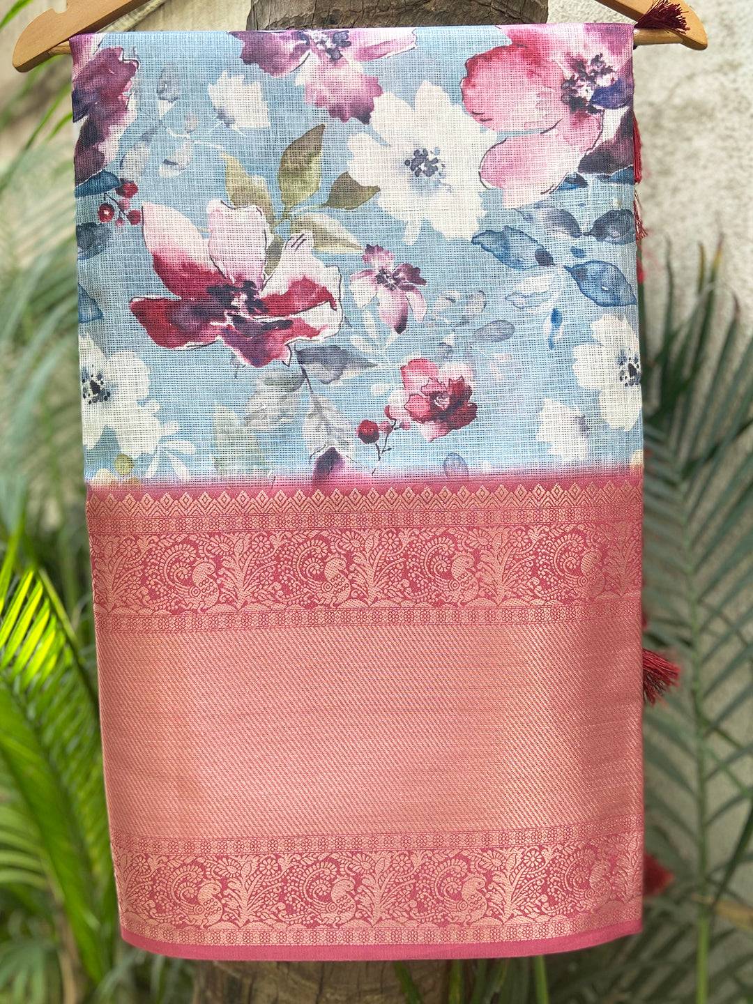 Sky blue Kota Doriya saree with floral print and gold zari border