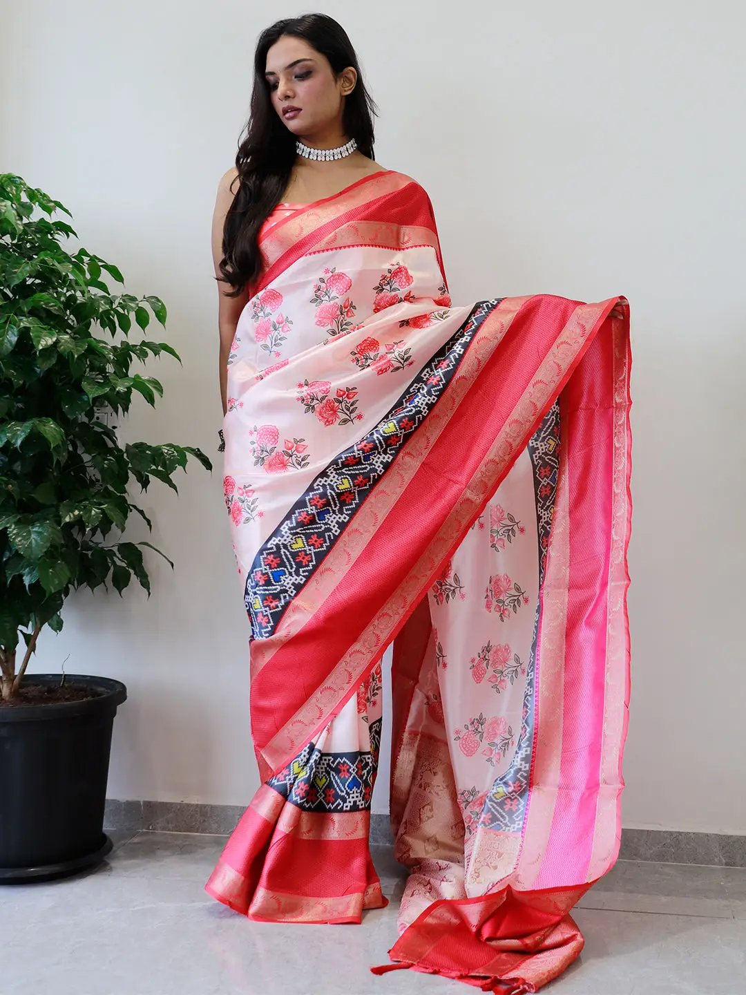 Soft silk saree with red Gadwal border and floral Pochampally print