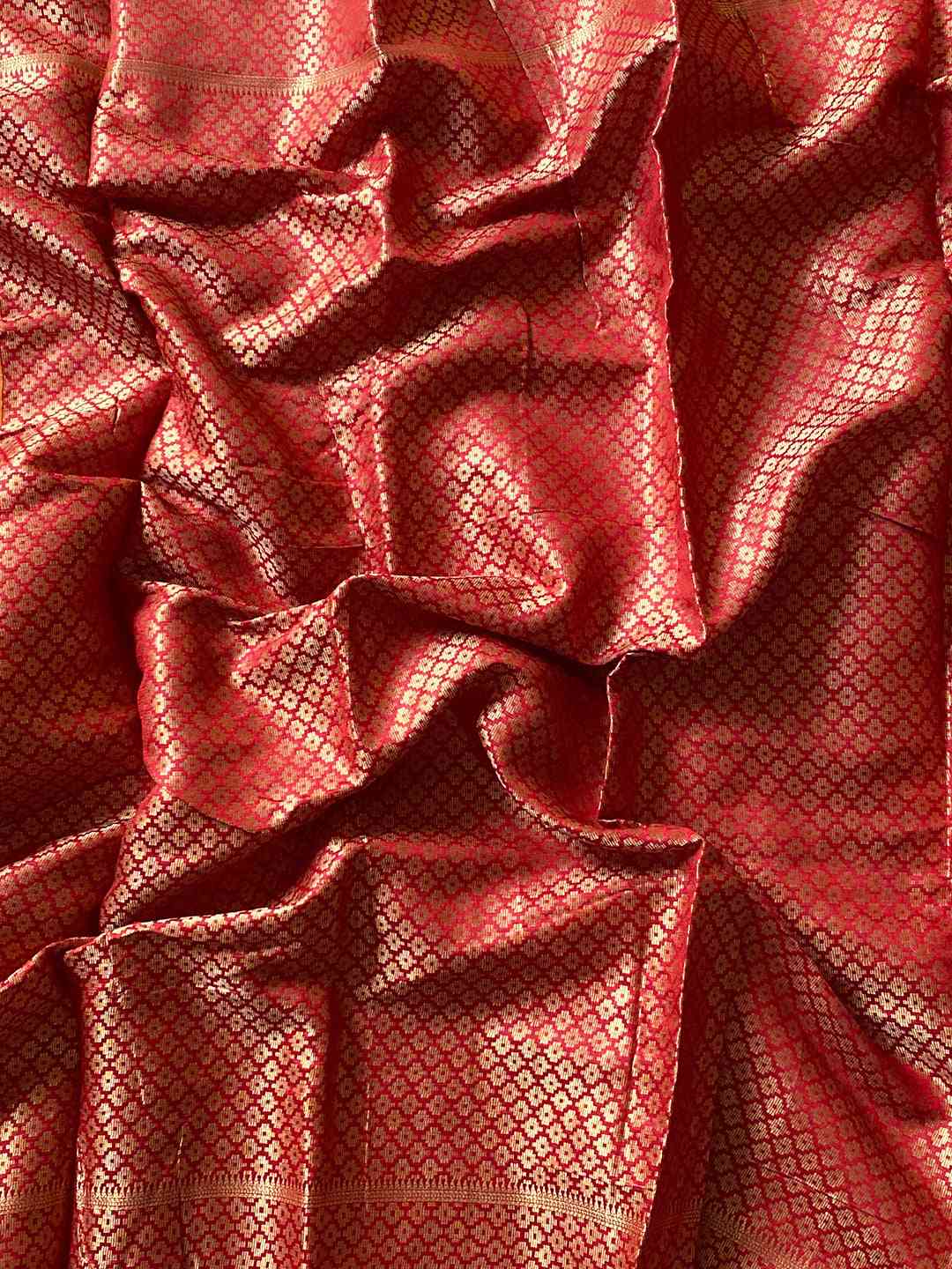 Close-up of Red Zari Woven Silk Fabric
