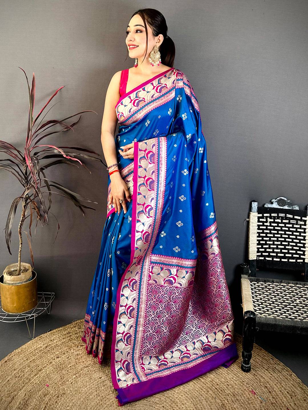 Model wearing Royal Blue Soft Silk Kanjivaram Saree with pink and gold border