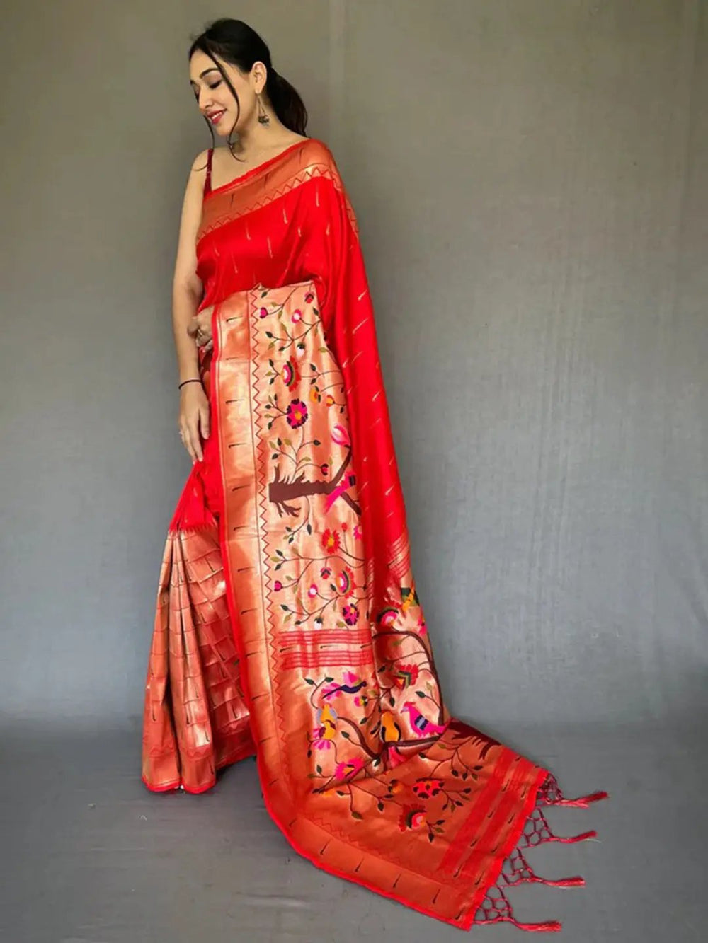 Elegant Royal Red Paithani saree with intricate zari work.
