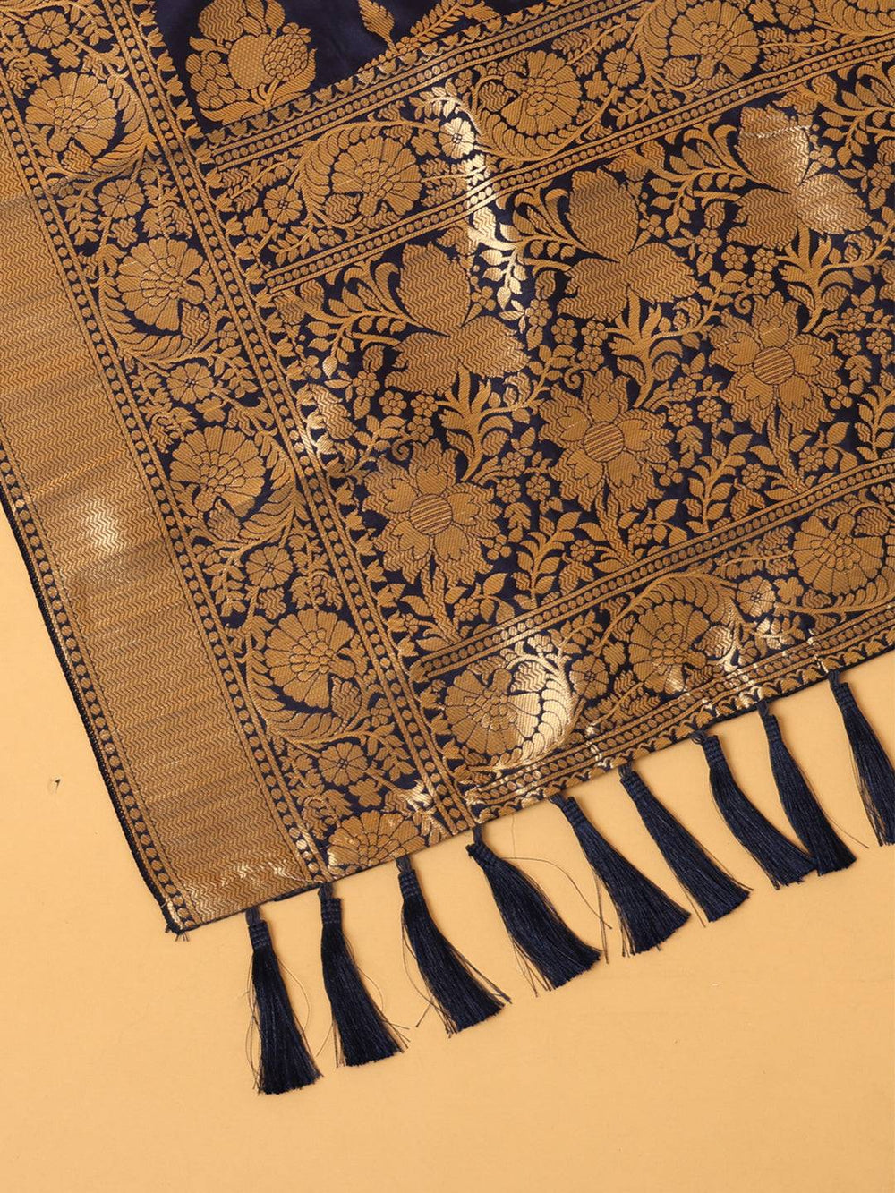 Close-up of dark blue silk blend dupatta with tassels and patterns