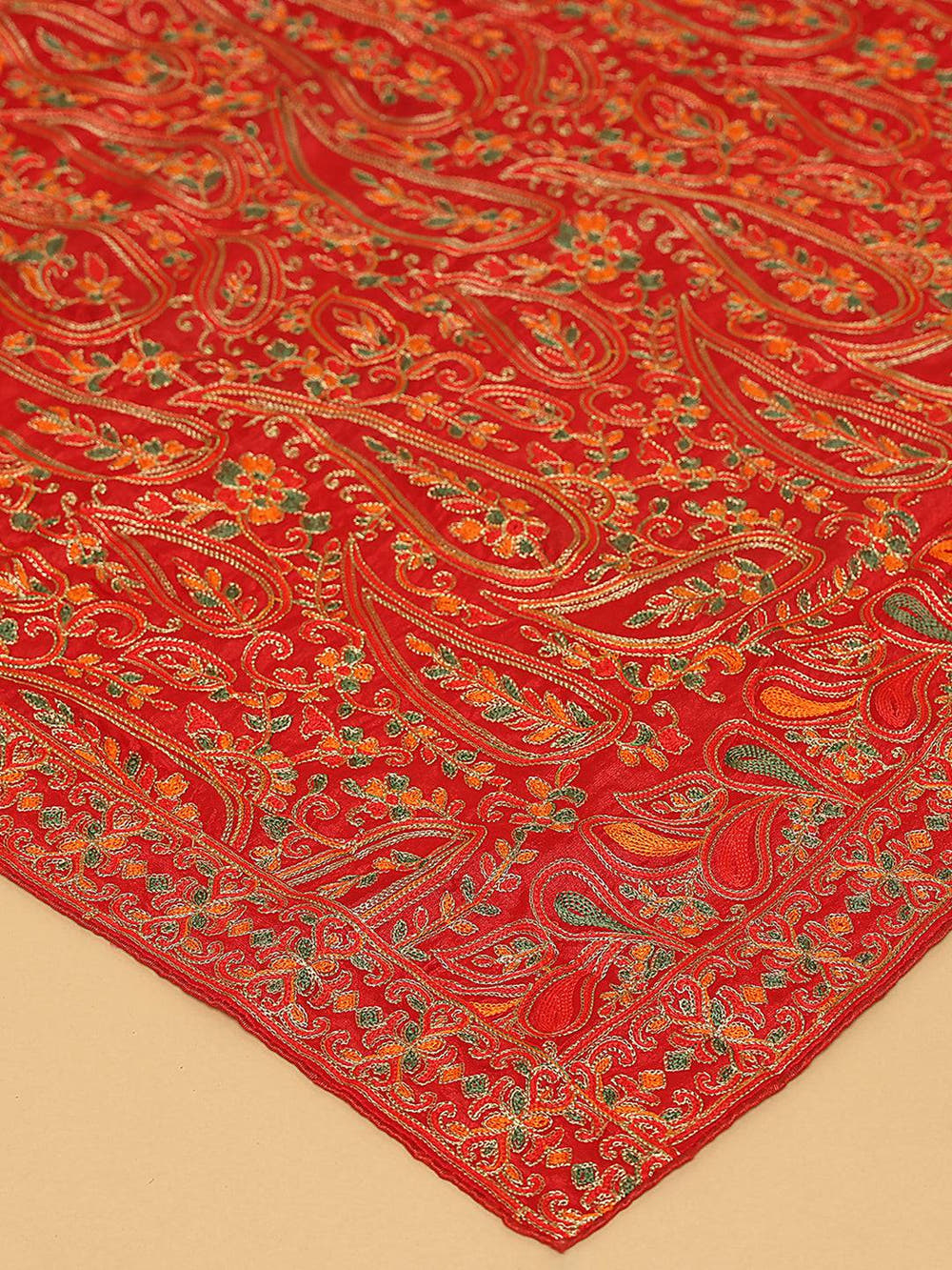 Close-up of intricate threadwork on red pashmina dupatta