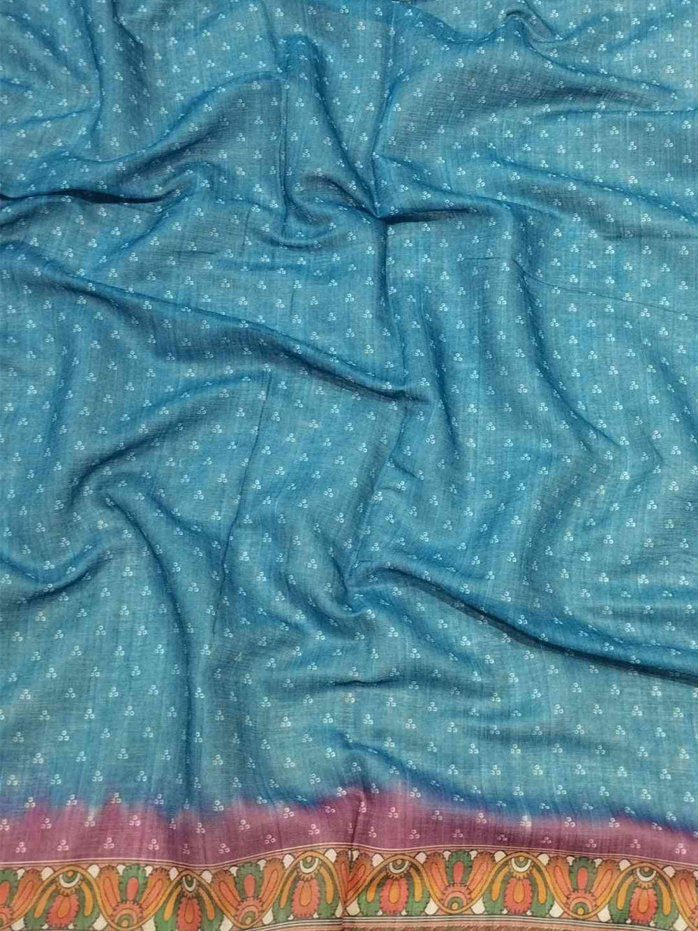 Close-up of blue linen saree fabric with Bandhej pattern