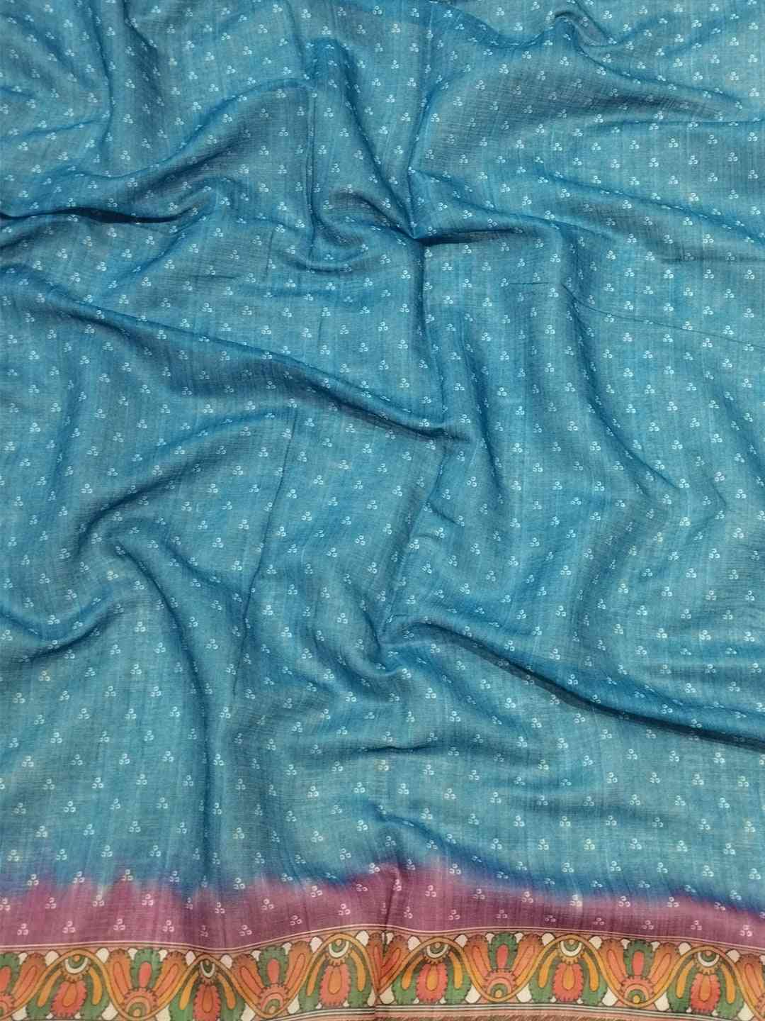 Close-up of blue linen saree fabric with Bandhej pattern