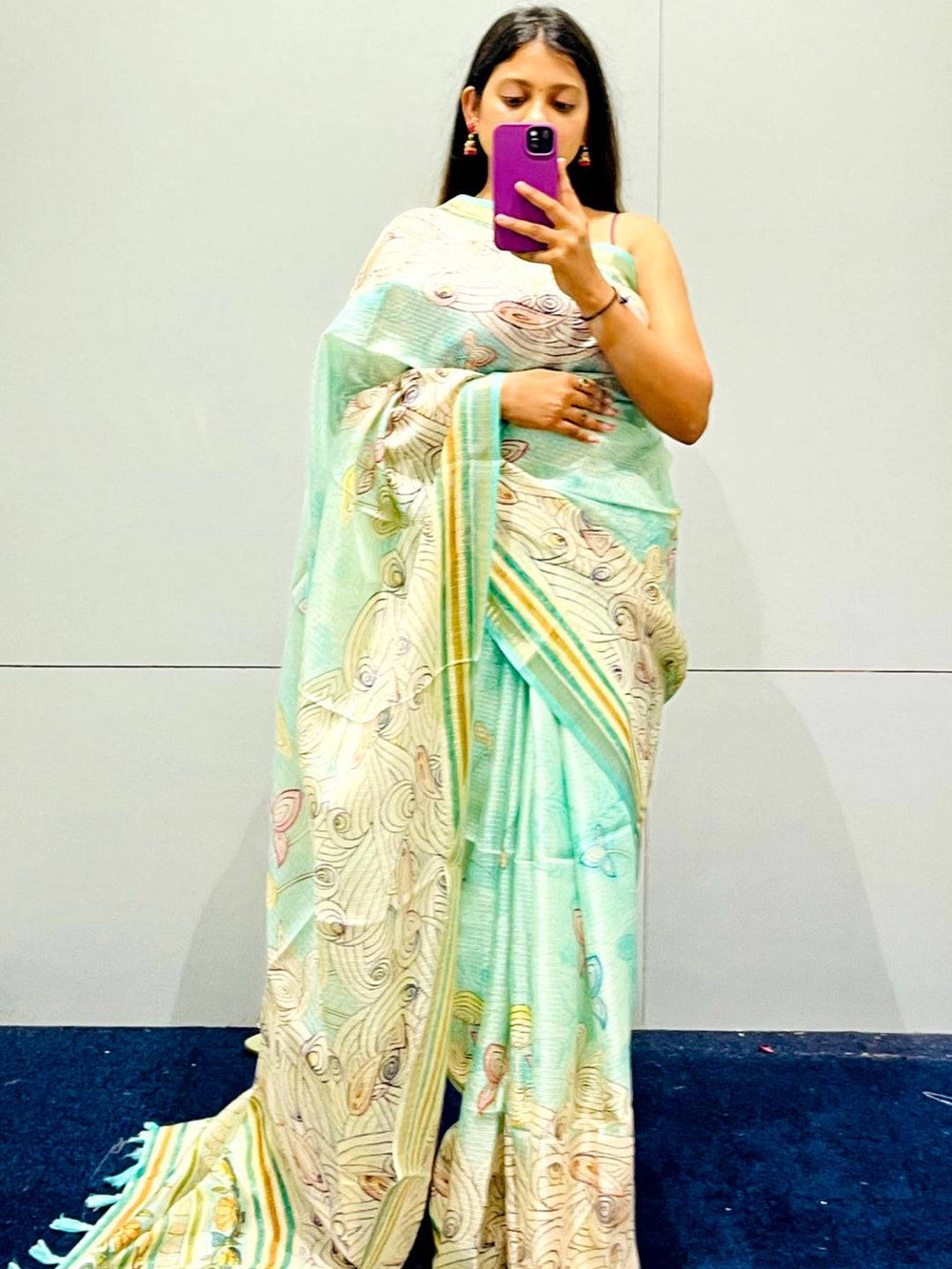Stylish turquoise silk saree with floral Kalamkari design
