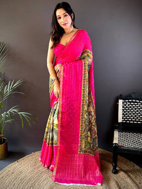 Vibrant pink Kalamkari saree with intricate border design