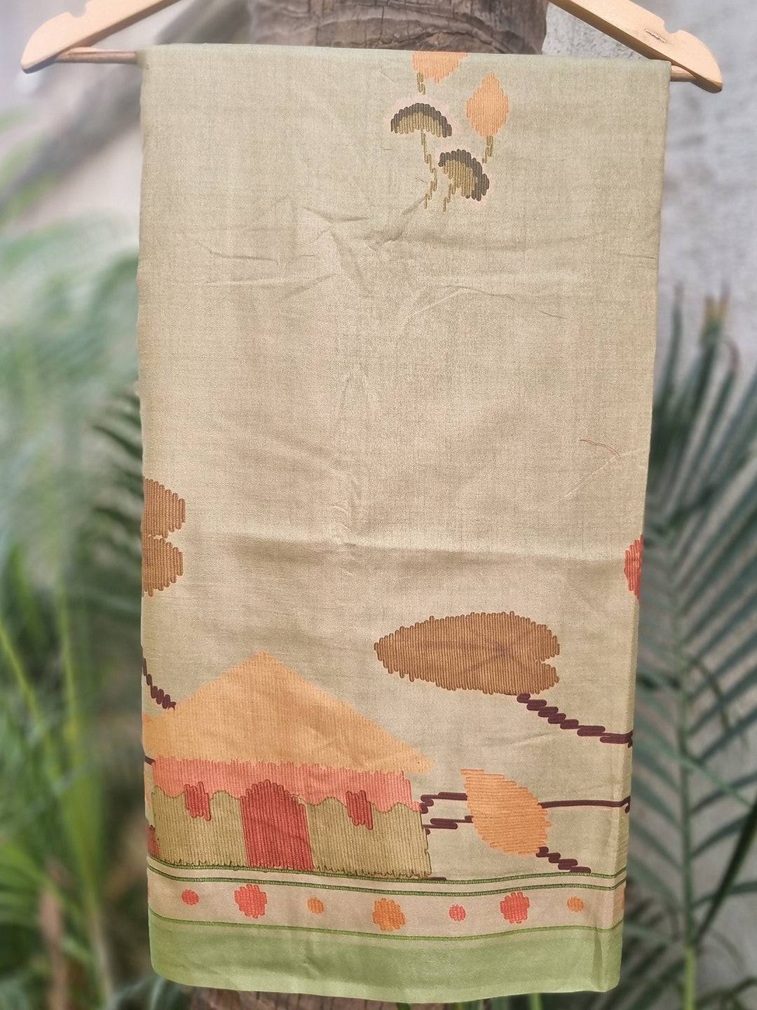 Pista Tussar Silk Saree with Ikkat Kalamkari Print on hanger