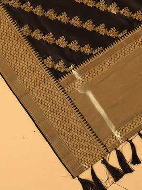 Close-up of black dupatta with intricate woven details.