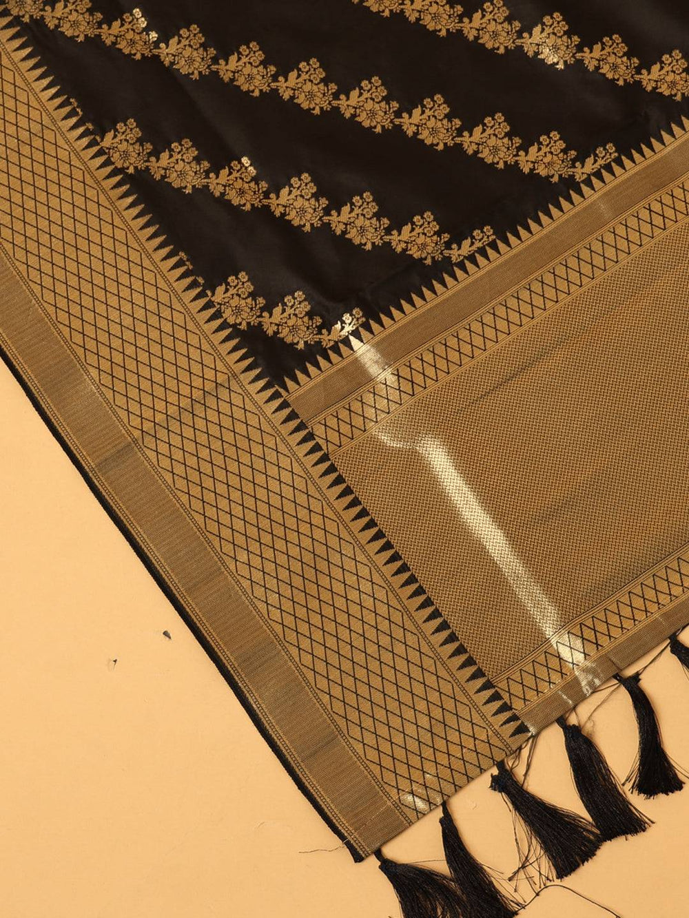 Close-up of black dupatta with intricate woven details.