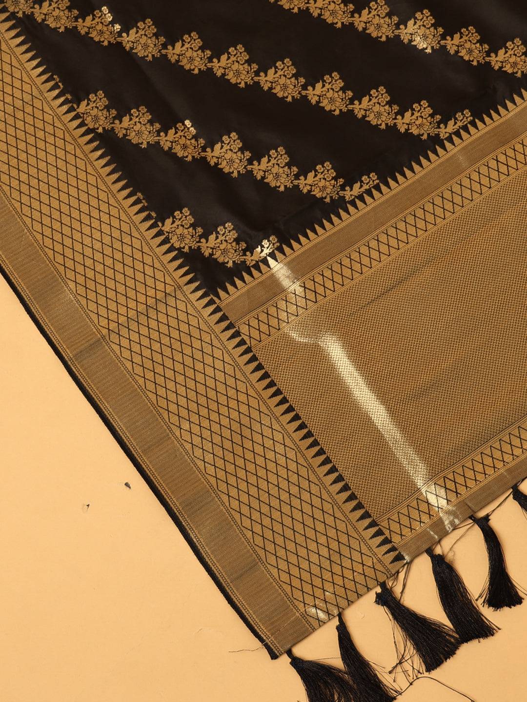 Close-up of black dupatta with intricate woven details.