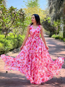 Neon pink floral print dress in garden setting