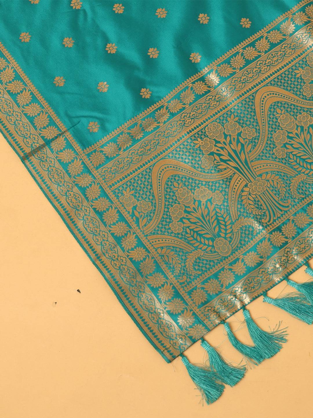 Close-up of turquoise dupatta with detailed woven patterns
