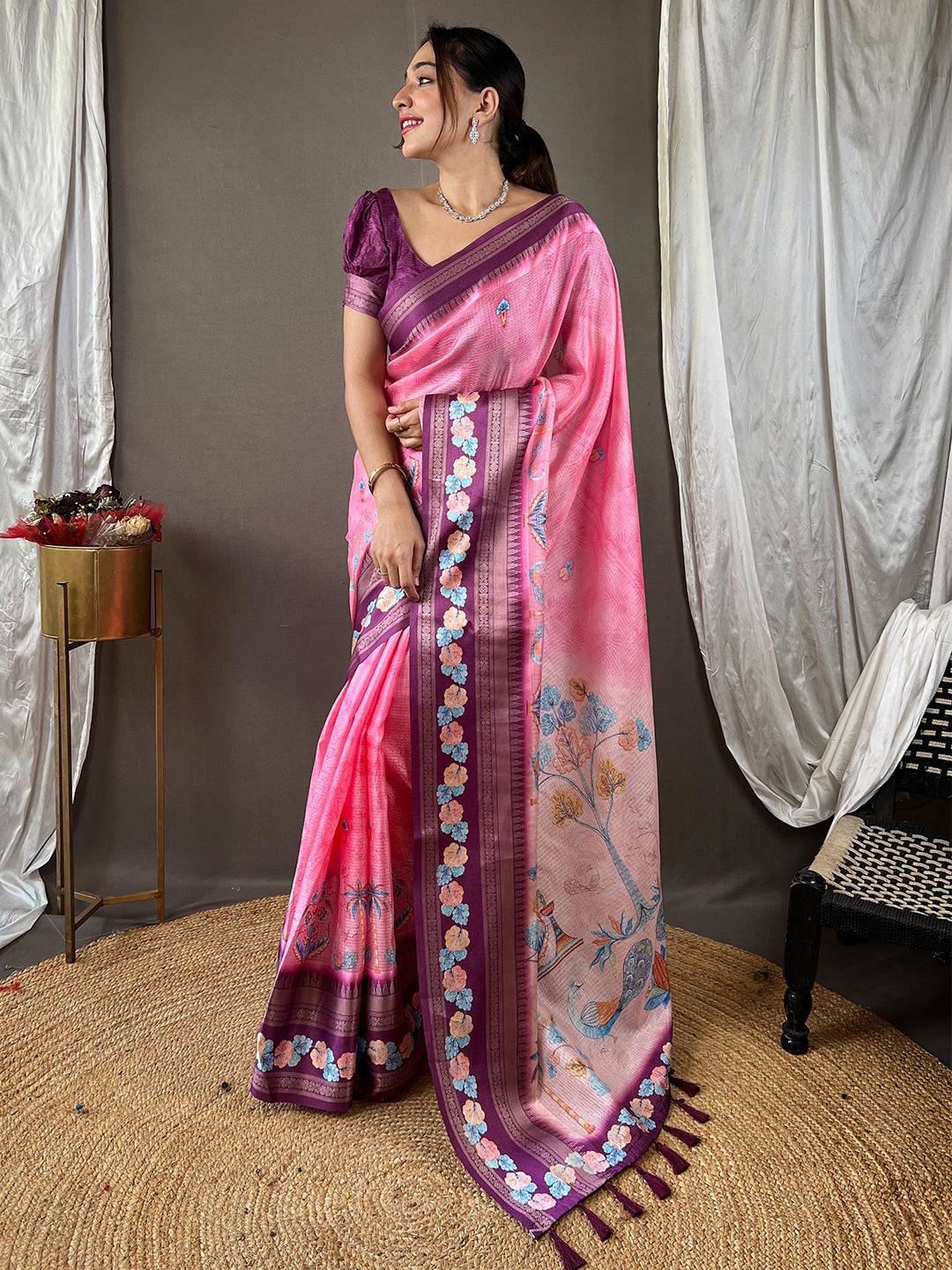 Pink Kota saree featuring rich Gadhwal satin border, floral motifs.