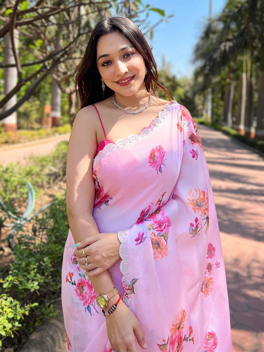 Pink floral satin georgette saree with zircon border