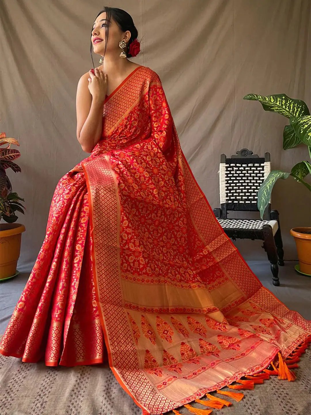 Luxurious red Patola silk saree with intricate zari design
