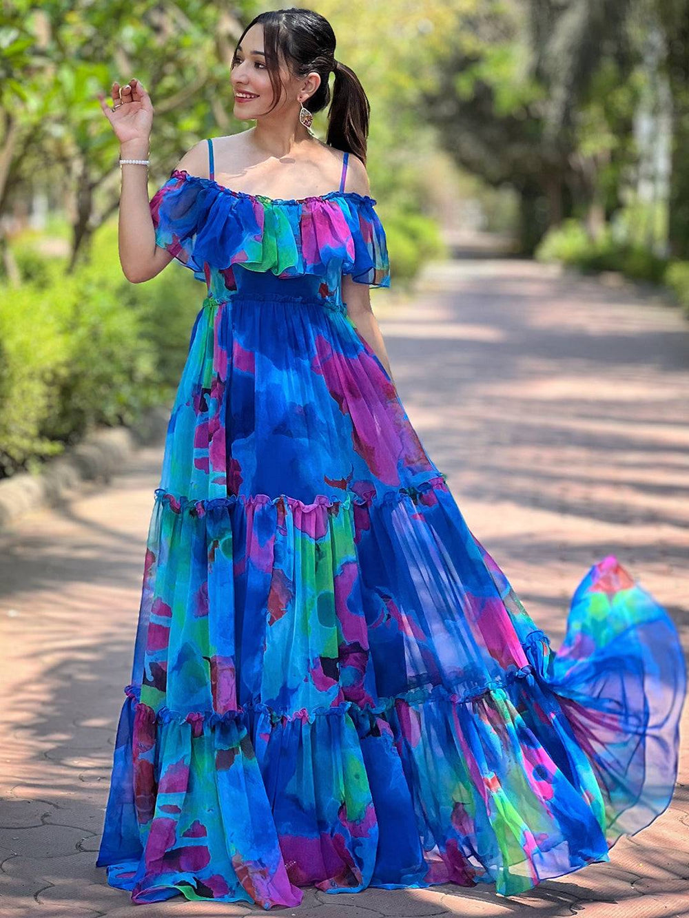 Woman in Persian Blue Abstract Print Dress outdoors