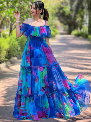 Woman in Persian Blue Abstract Print Dress outdoors