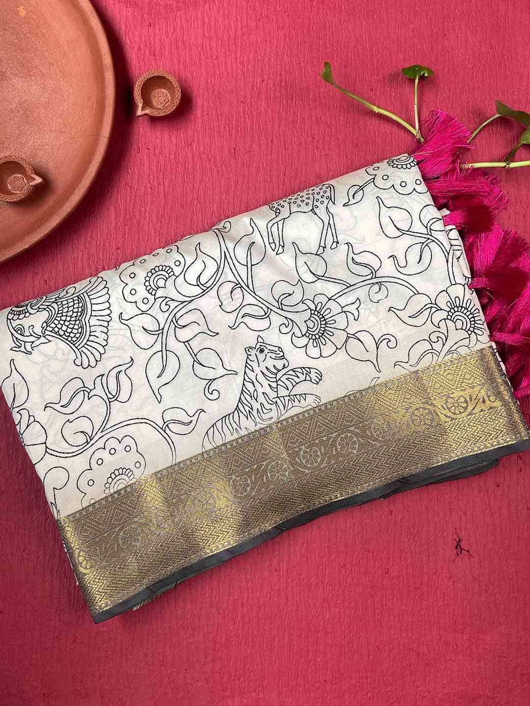 Folded Kalamkari saree with block print and gold border