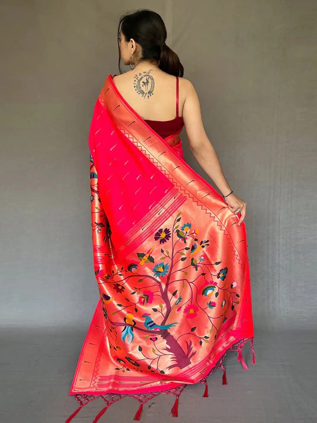 Back view of pink Paithani saree showcasing floral design