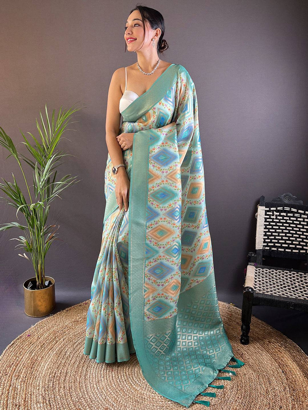 Elegant mint green saree with geometric and floral design