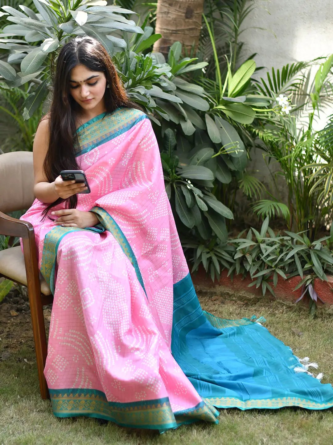 Pink Bandhej silk saree with blue Kanjivaram border
