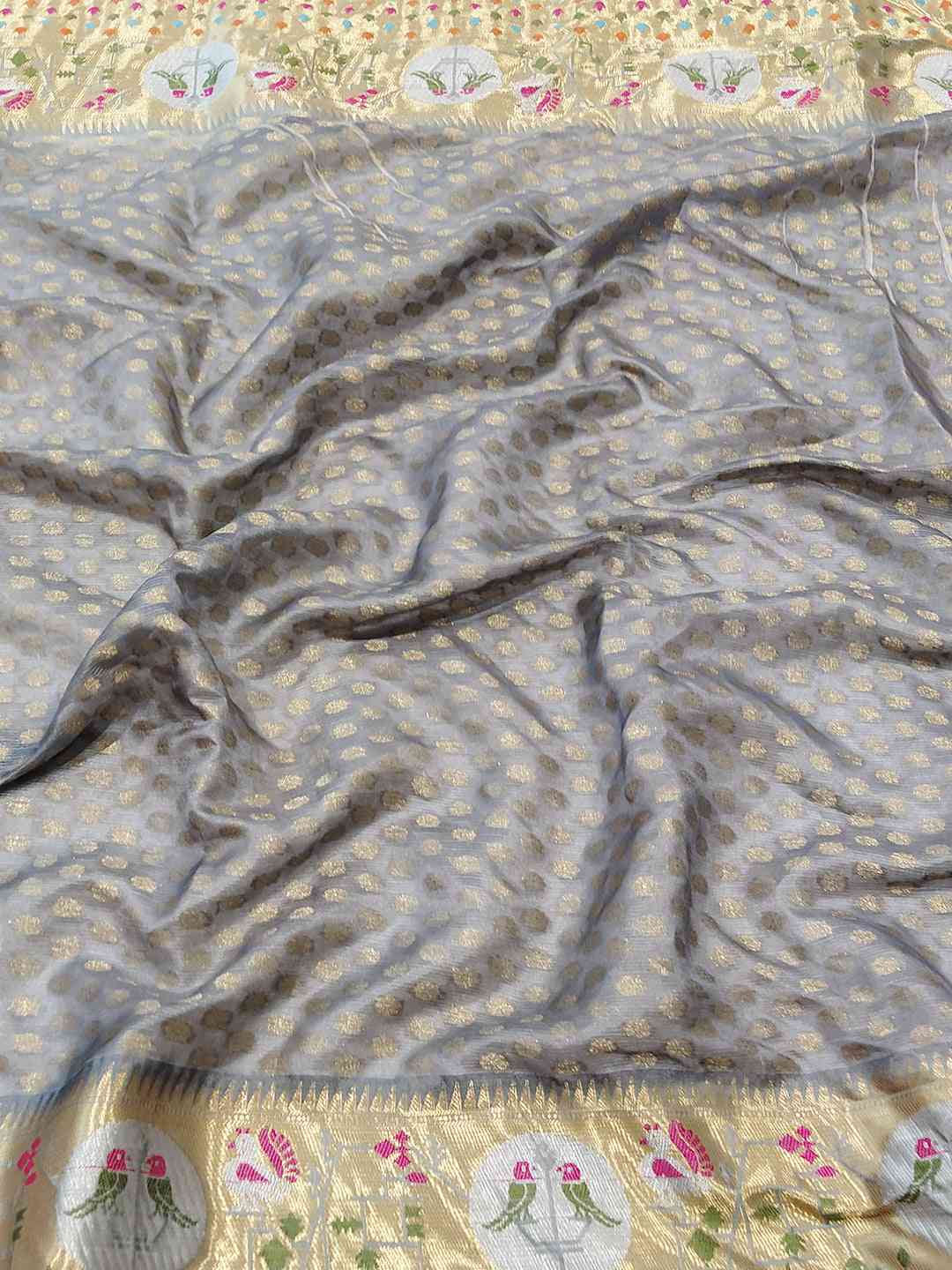 Close-up of Kota Doria silk saree with detailed Minakari Patola work