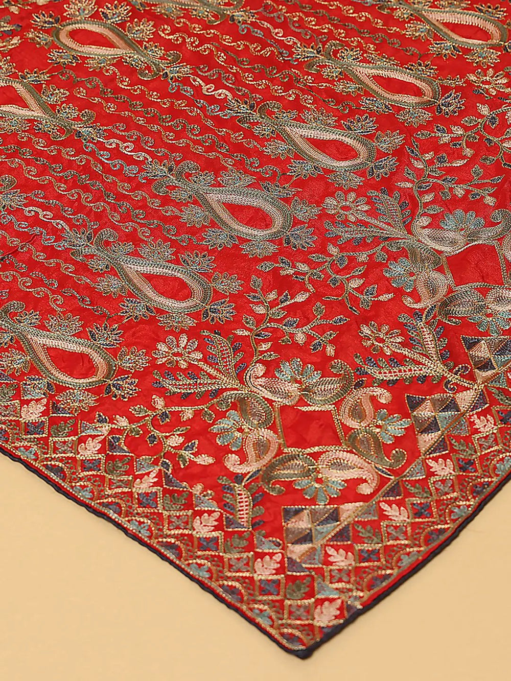 Close-up of red dupatta showcasing intricate threadwork